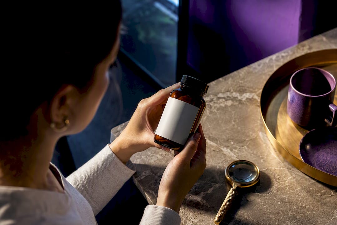 Shopper examining an anonymous supplement label